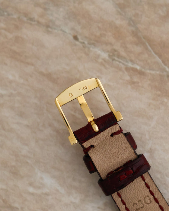 Close-up of the original Blancpain 18K yellow gold pin buckle showing the 750 hallmark and maker's mark.