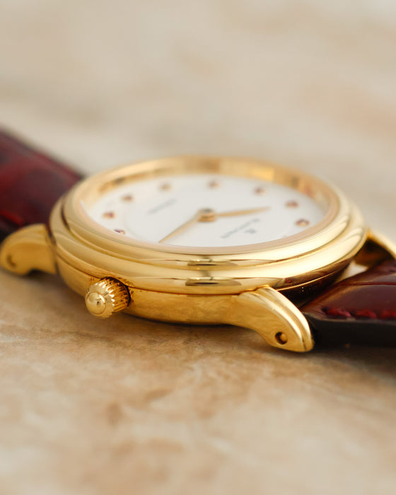 Detailed side view of the Blancpain Lady Villeret highlighting its curved gold lugs, polished case and crown.