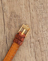 Reverse view of the Rolex Orchid buckle showing the Rolex signature and Swiss Plaqué G engraving.