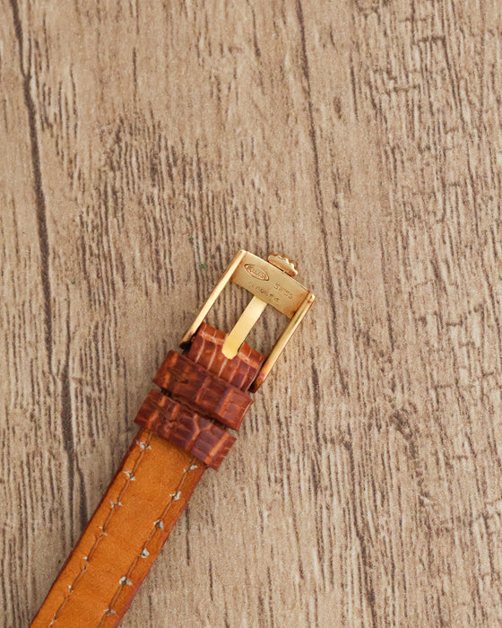 Reverse view of the Rolex Orchid buckle showing the Rolex signature and Swiss Plaqué G engraving.