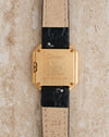 Rear view of Cartier Ceinture Ref. 6602 showing the engraved 18K yellow gold caseback and four securing screws.