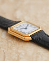 Close-up of the layered 18K yellow gold case and beveled corners of the vintage Cartier Ceinture.