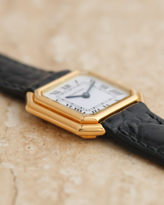 Close-up of the layered 18K yellow gold case and beveled corners of the vintage Cartier Ceinture.