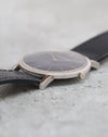 Side profile of the vintage Audemars Piguet highlighting its slim white gold case, polished bezel and winding crown.