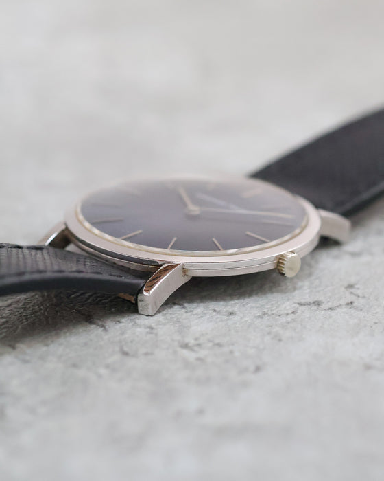 Side profile of the vintage Audemars Piguet highlighting its slim white gold case, polished bezel and winding crown.