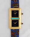 Front view of the Chopard Kutchinsky Dual Time with twin black onyx dials, turquoise centrepiece and blue paisley strap.