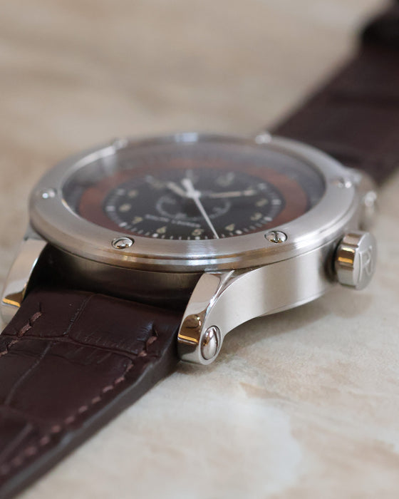 Side profile showing the brushed stainless steel case, screw-set bezel and distinctive lugs.