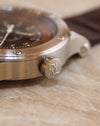 Macro photograph of the stainless steel crown engraved with the Ralph Lauren RL monogram.