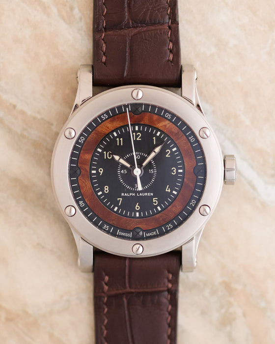 Front view showing the 38.7mm stainless steel case and elm burl wood dial.