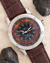 Angled overhead photograph of the Ralph Lauren Automotive Chronometer with elm burl wood dial and brown leather strap.