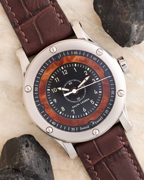 Angled overhead photograph of the Ralph Lauren Automotive Chronometer with elm burl wood dial and brown leather strap.