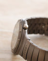 Side profile of the Porsche Design Ocean 500 showing the crown, titanium case and Ocean-engraved bracelet link.