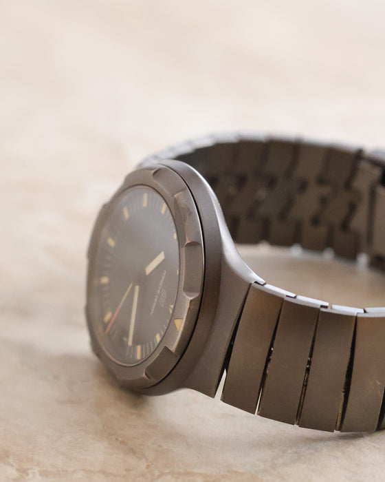 Angled side view of the IWC Porsche Design Ocean 500 highlighting its recessed rotating bezel and integrated titanium bracelet.