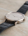 Side profile showing the slim white gold case, polished bezel and shaped lugs.
