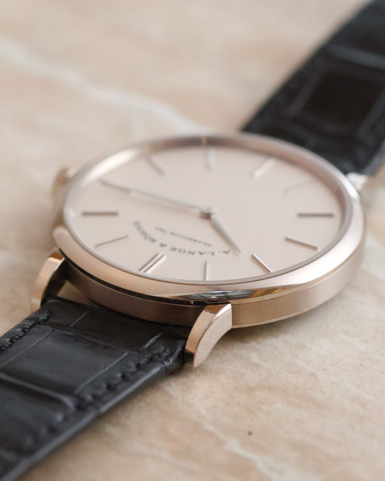 Low-angle detail of the slim Saxonia Thin case and black leather strap.