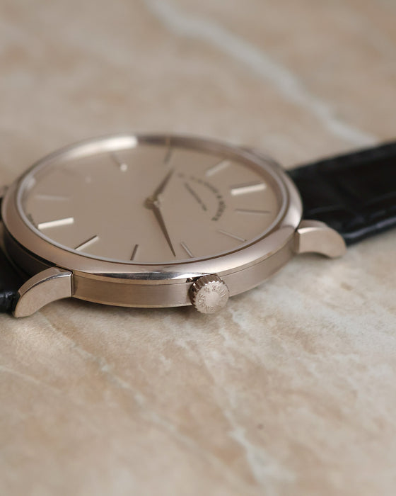 Close-up of the signed winding crown and brushed caseband on the Saxonia Thin.