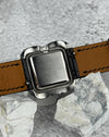 Case back of Universal Genève Flower Cushion vintage watch in stainless steel, showing 1970s construction and finish