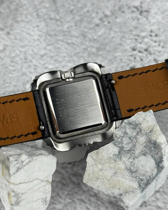 Case back of Universal Genève Flower Cushion vintage watch in stainless steel, showing 1970s construction and finish
