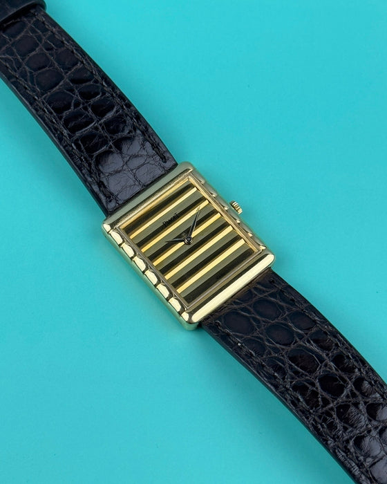 Piaget Ref. 91480 vintage dress watch in 18K yellow gold with ribbed gold dial and slim tank case, c. 1980s