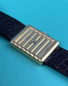 Close-up of Piaget 91480 dial featuring vertically ribbed 18K gold texture and matching gold baton hands