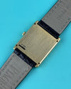 Case back of Piaget 91480 tank watch in solid yellow gold with rectangular silhouette and smooth finish