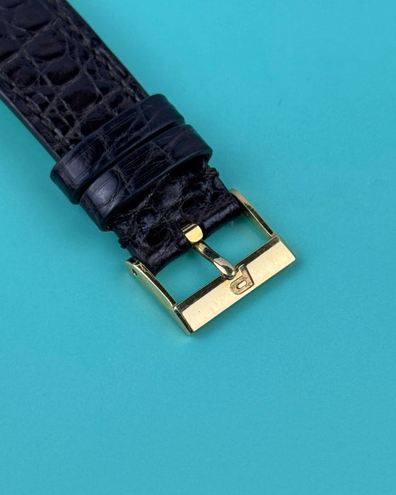 Original Piaget 18K yellow gold buckle paired with black leather strap on Ref. 91480 vintage watch