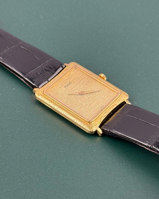 Side profile of Piaget 9254 showing slim 18K gold case and textured bark guilloché detailing