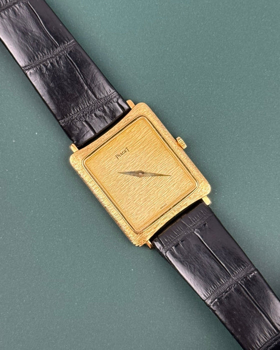 Piaget Ref. 9254 vintage tank watch in 18K gold with bark-style guilloché dial and case, c. 1980s