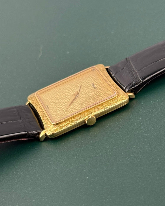 Crown-side angle of Piaget Ref. 9254 highlighting bark guilloché finish and minimalist crown design