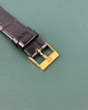 Gold-tone Piaget buckle paired with classic leather strap on Ref. 9254 vintage tank watch