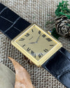 Elegant Piaget 9152 rectangular gold watch with matching guilloché case and dial, featuring slim gold hands