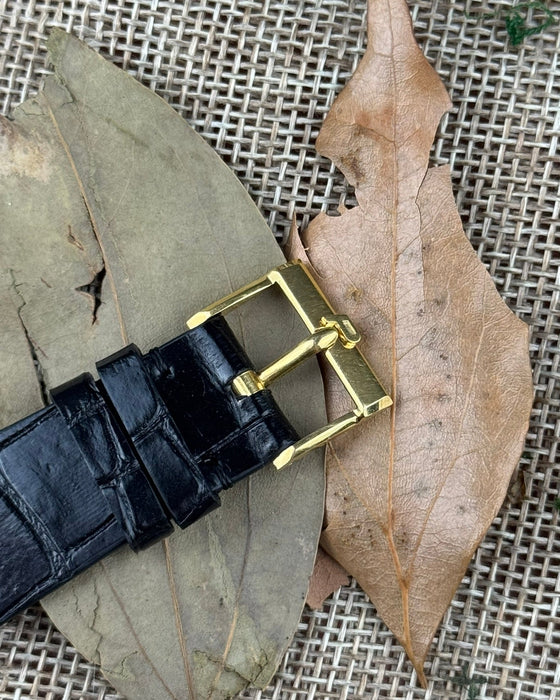 Original Piaget 18K yellow gold buckle engraved with logo, paired with leather strap