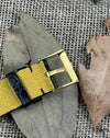 Close-up of Piaget-signed gold buckle on black leather strap, part of Ref. 9152 vintage dress watch