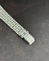 Detailed view of 18K white gold bamboo-style bracelet on Audemars Piguet ladies’ watch with textured links