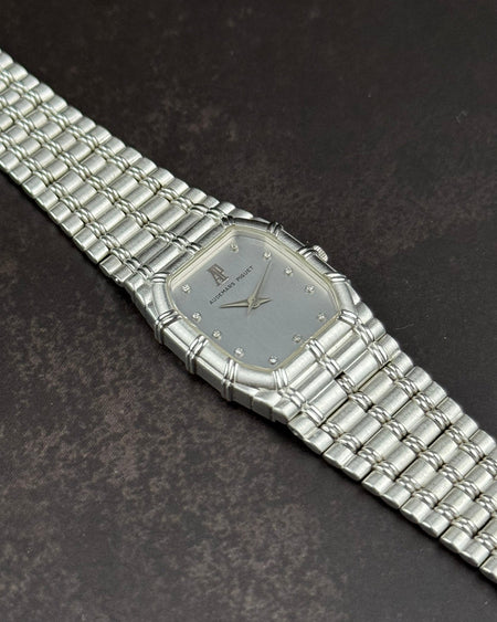 Close-up of white dial on Audemars Piguet Bamboo watch featuring diamond markers and sapphire crystal