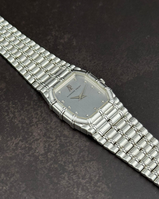 Close-up of white dial on Audemars Piguet Bamboo watch featuring diamond markers and sapphire crystal