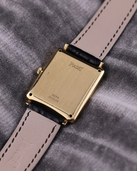 Rear view of the Piaget 9251 showing the solid 18K yellow gold case back with subtle hallmarks and signs of gentle wear.