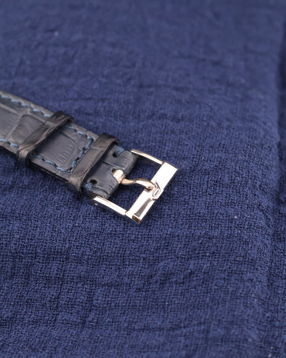 Original Piaget 18K white gold buckle with blue sapphire cabochon, paired with leather strap