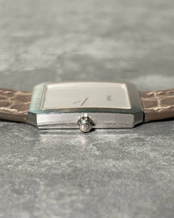 Piaget Protocole 90154 side view with crown, featuring sculpted case and engraved white gold bezel
