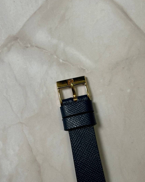 Original Piaget 18K yellow gold buckle on leather strap, signed and period-correct for Ref. 7143