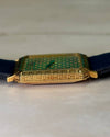 Side profile of Piaget 7143 watch showcasing slim 18K yellow gold case and integrated design